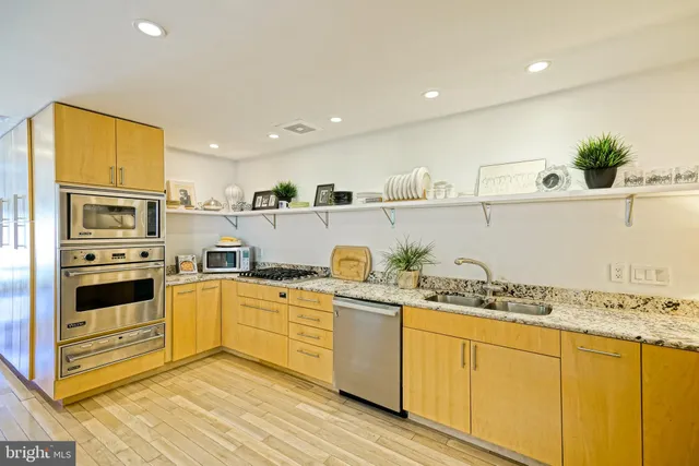 a spacious bedroom with a bed and a couch