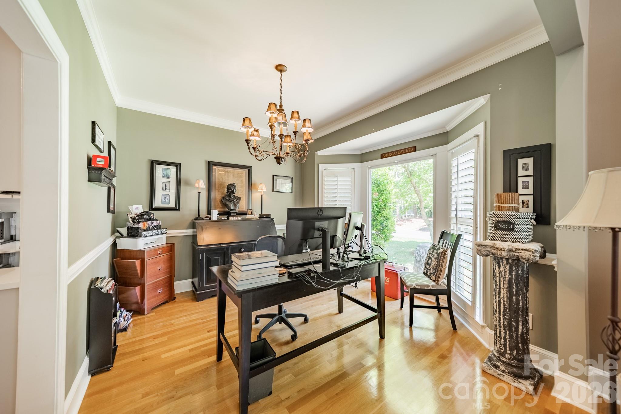 11043 Seven Coves Drive Tega Cay, SC 29708 - Photo 15 of 45 a living room with furniture and a chandelier