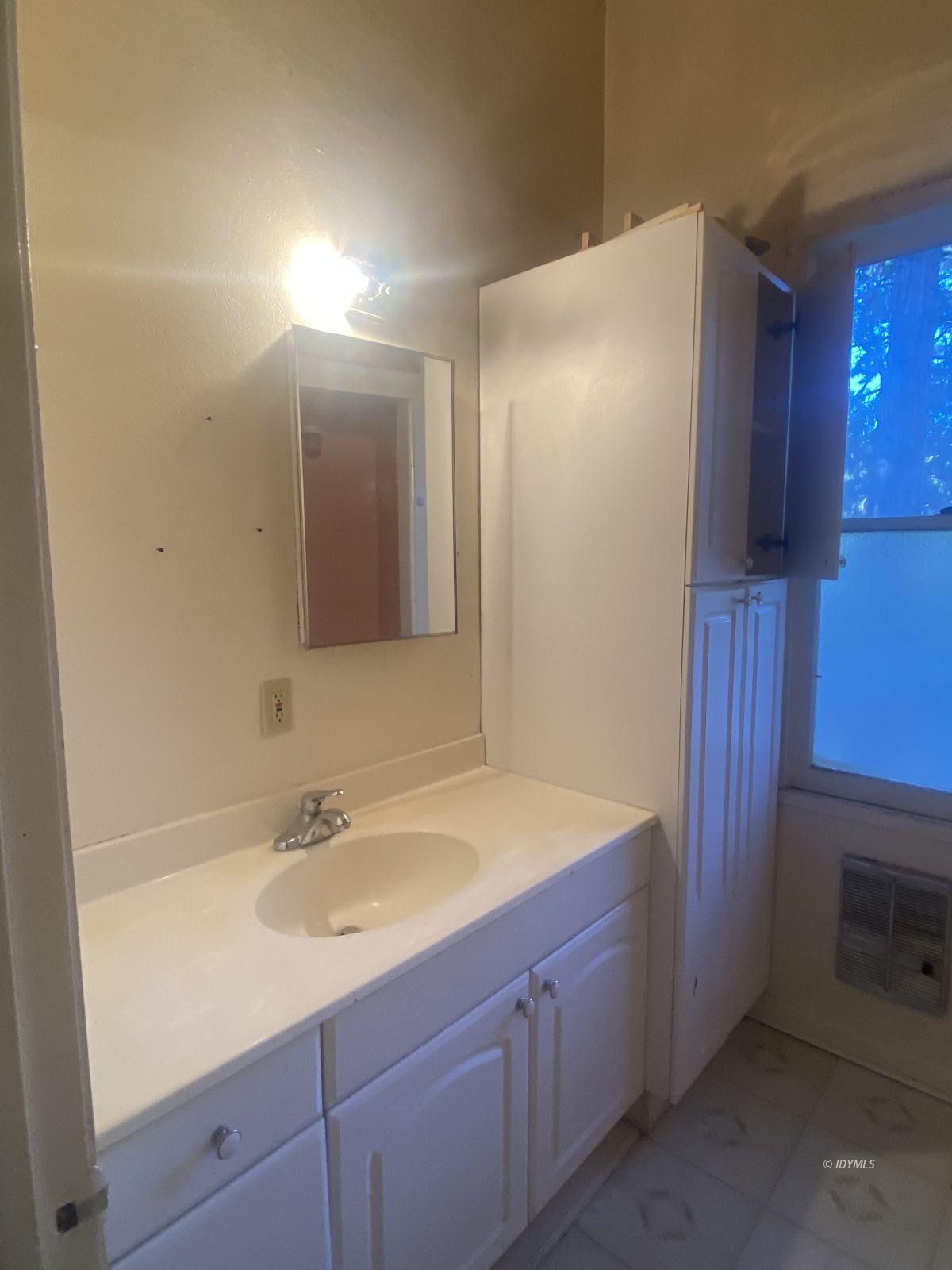 52725 Idyllmont Road Idyllwild, CA 92549 - Photo 22 of 29 a bathroom with a sink and a mirror