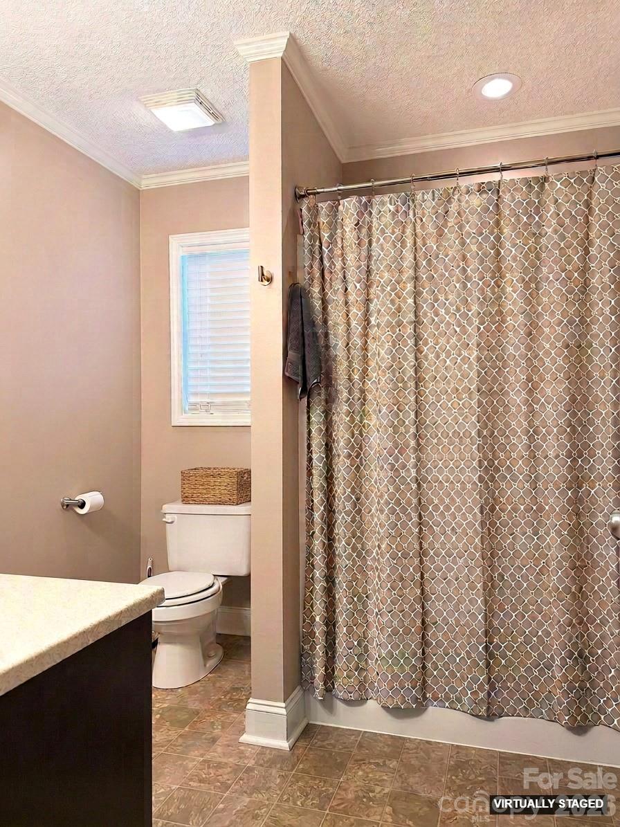 5876 St Peters Church Road Conover, NC 28613 - Photo 13 of 25 a bathroom with a shower curtain and a sink