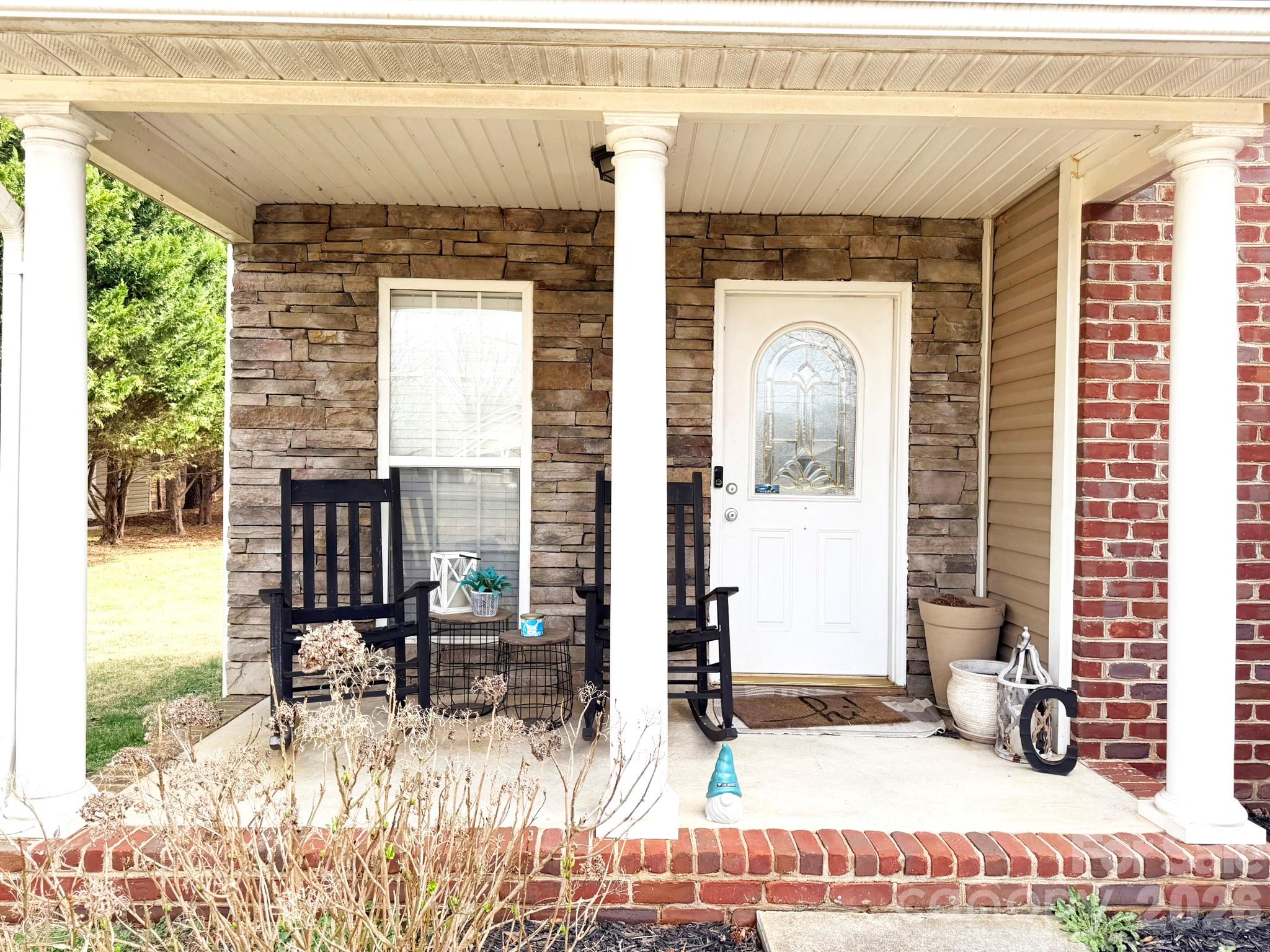 5876 St Peters Church Road Conover, NC 28613 - Photo 2 of 25 a front view of a house with basket ball court tables and chairs