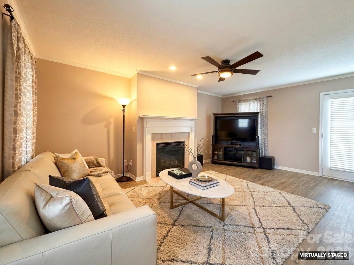 5876 St Peters Church Road Conover, NC 28613 - Photo 3 of 25 a living room with furniture a flat screen tv and a fireplace