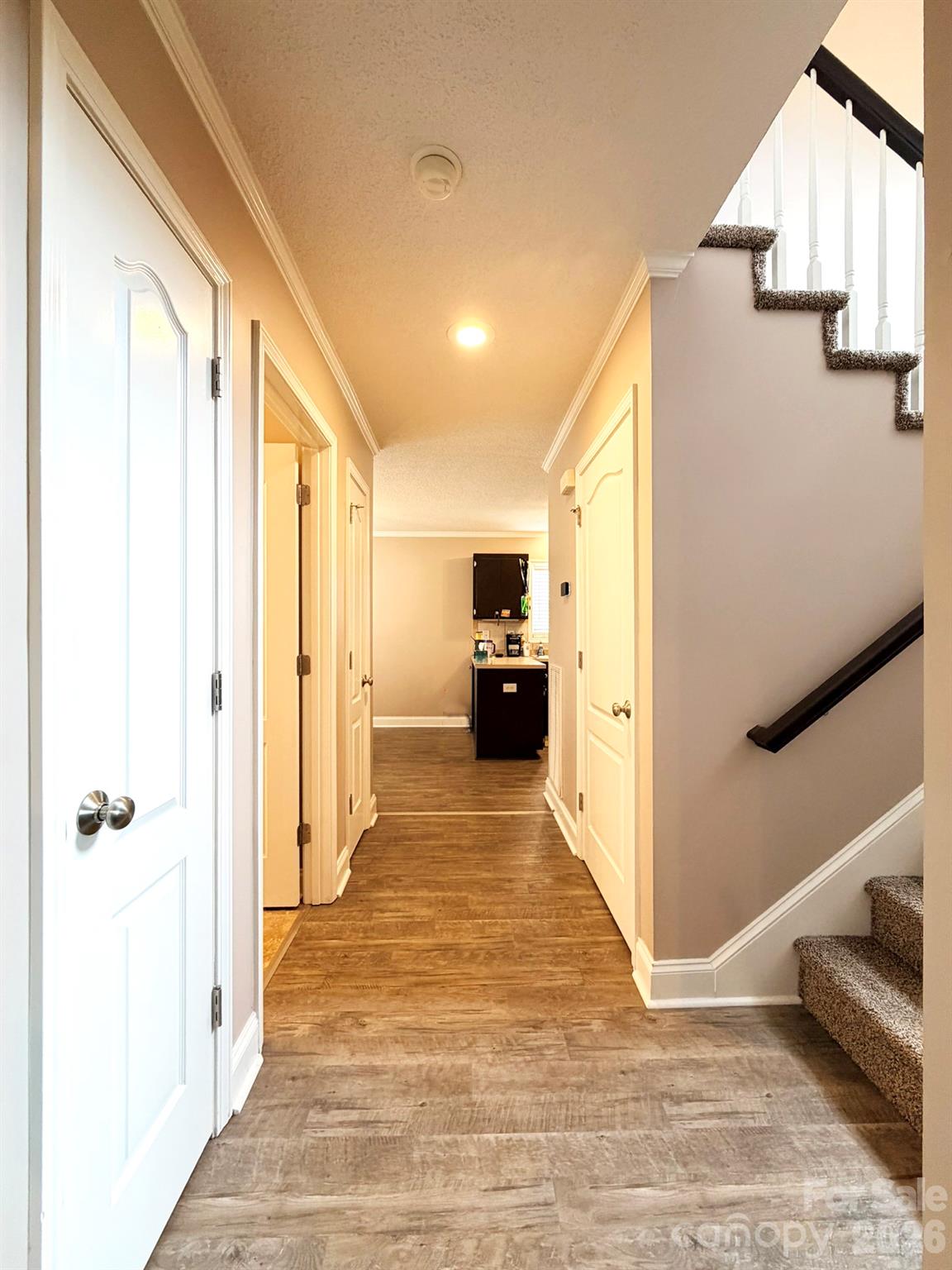 5876 St Peters Church Road Conover, NC 28613 - Photo 4 of 25 a view of a hallway view with wooden floor and staircase