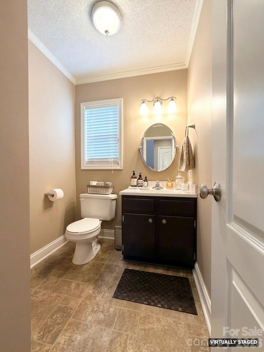 5876 St Peters Church Road Conover, NC 28613 - Photo 9 of 25 a bathroom with a toilet sink and mirror