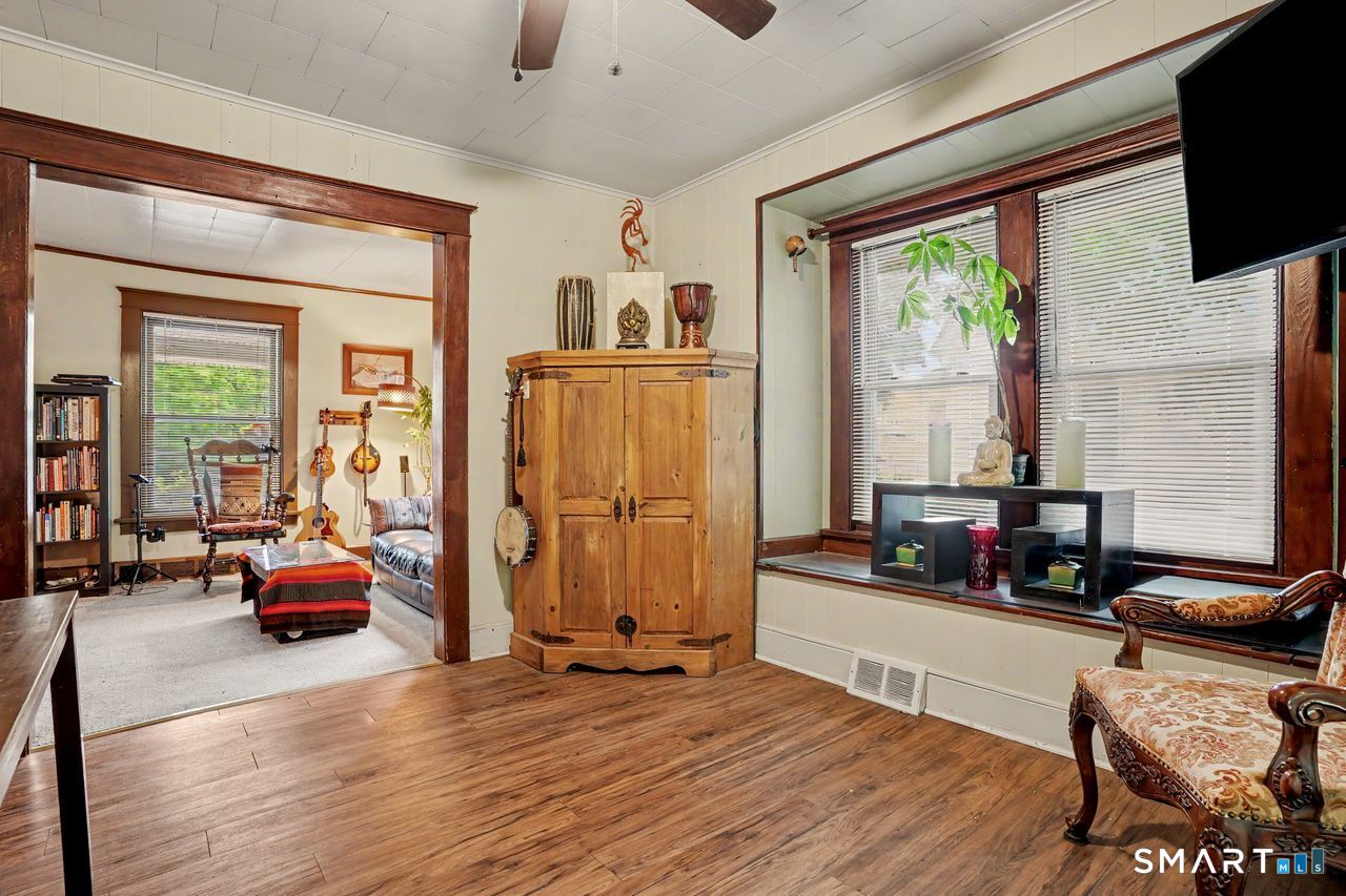 74 Maple Street Seymour, CT 06483 - Photo 15 of 40 a view of living room with furniture and large windows