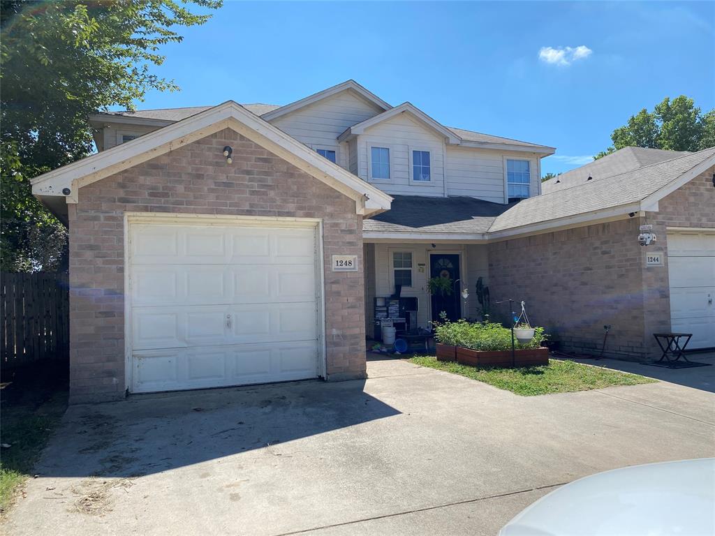 1248 Village Garden Azle, TX 76020 - Photo 3 of 9 a front view of a house with a yard