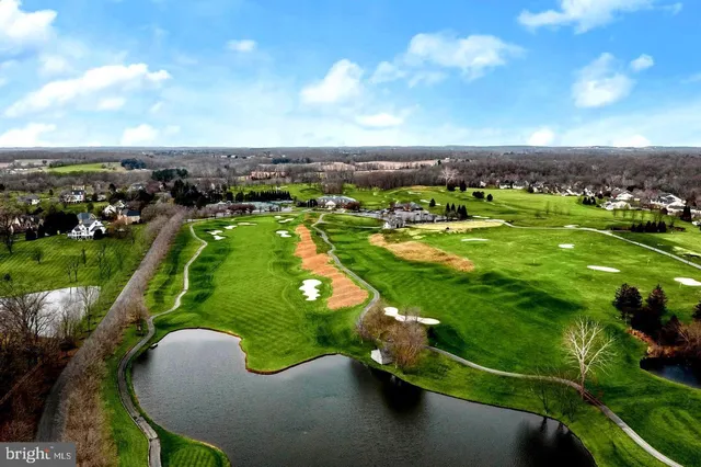 an aerial view of a house with a yard and plants