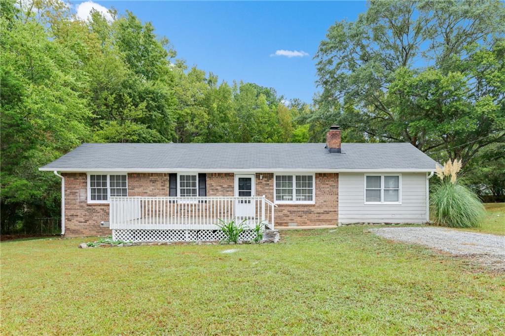 1232 Marshall Fuller Road Dallas, GA 30157 - Photo 1 of 1 front view of house with a yard