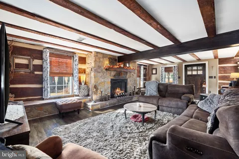 a living room with furniture or couch and a fireplace