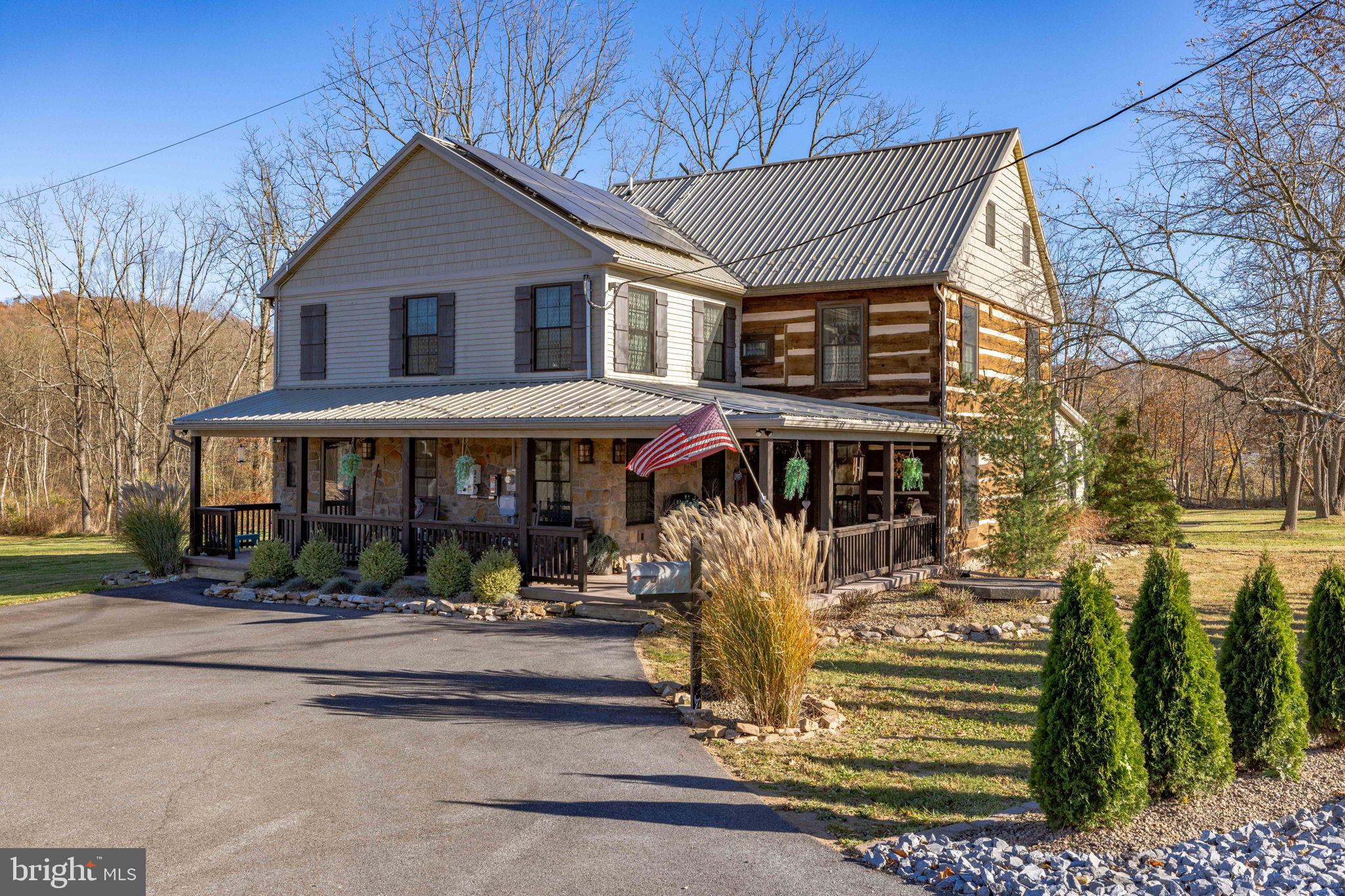 3204 Highway 72 Jonestown, PA 17038 - Photo 2 of 64 a patio with a table and chairs under an umbrella