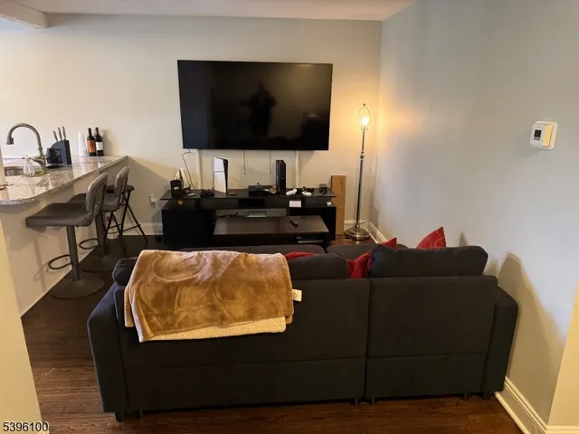 an empty room with wooden floor