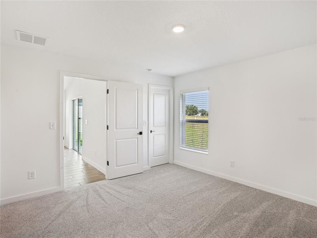 Undisclosed Address Lakeland, FL 33809 - Photo 7 of 7 a view of an empty room with a window