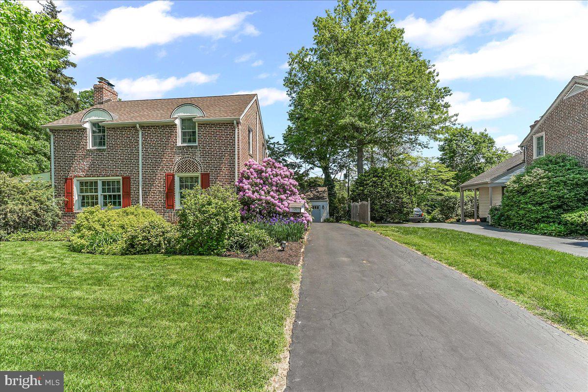 106 Barley Mill Road Wallingford, PA 19086 - Photo 35 of 50 a front view of a house with a yard