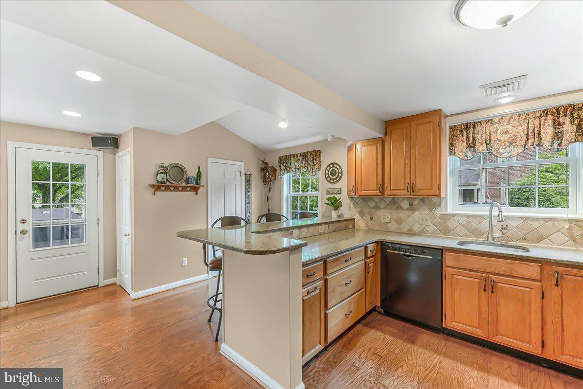 106 Barley Mill Road Wallingford, PA 19086 - Photo 10 of 50 a kitchen with a sink stove and cabinets