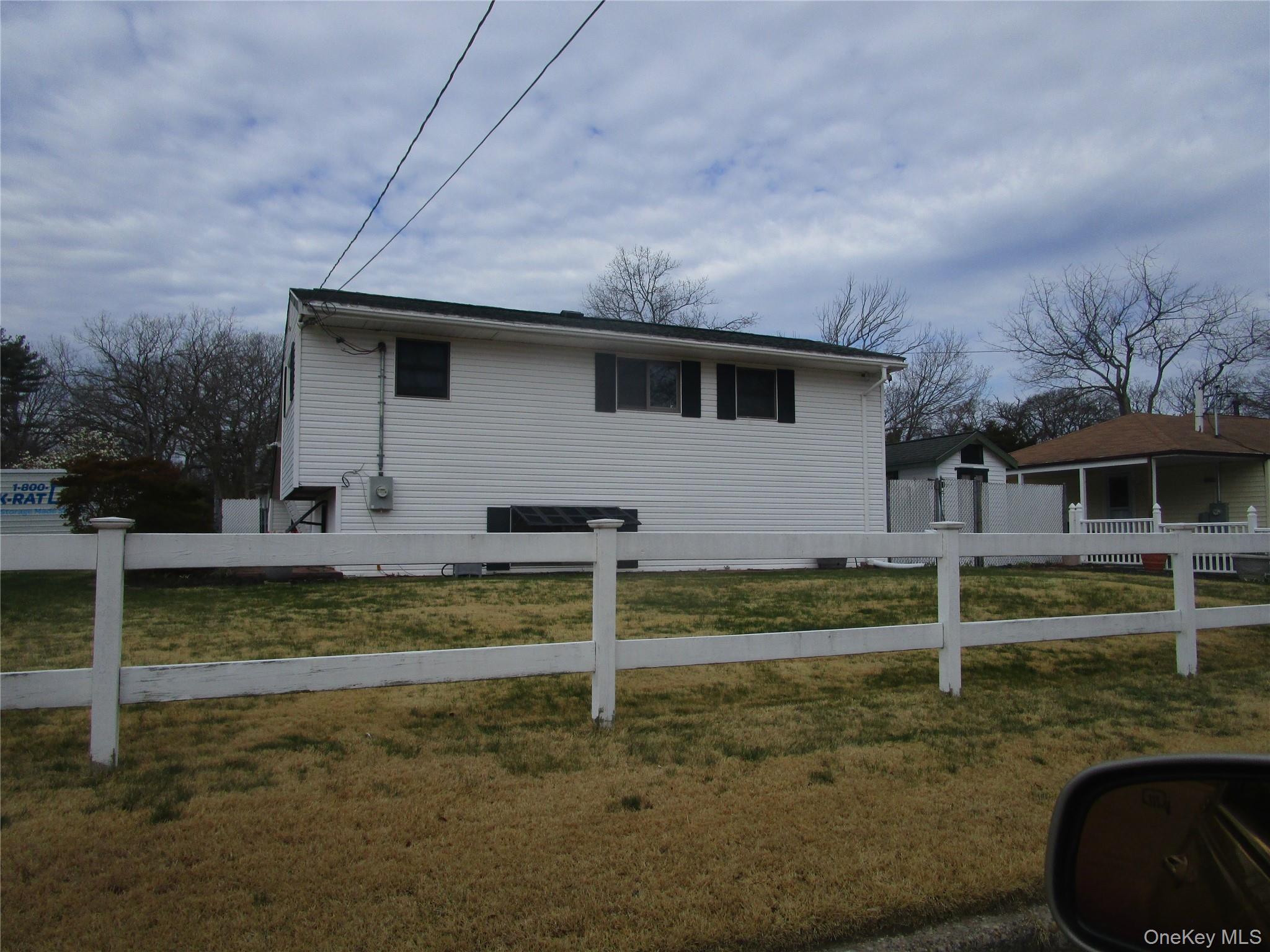 116 Holly Road Centereach, NY 11720 - Photo 2 of 3 a view of a house with a yard