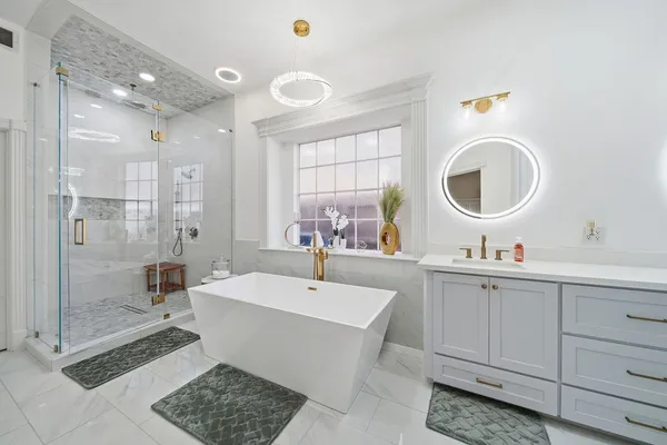 a bathroom with a double vanity sink a mirror and a shower