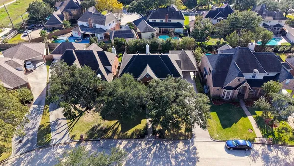 an aerial view of house with yard swimming pool and outdoor seating