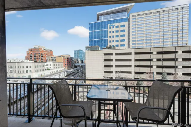a balcony view with a seating space