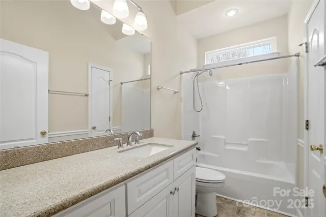 front view of a house with a large window