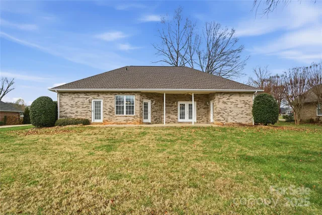 aerial view of a house with a yard