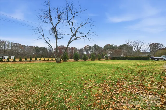 an aerial view of a house with a lake view