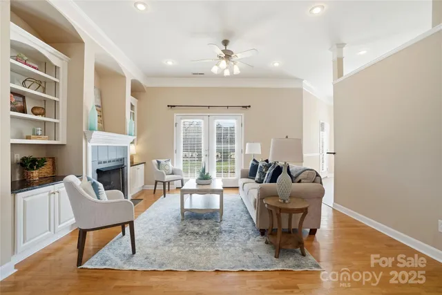a living room with furniture and a fireplace