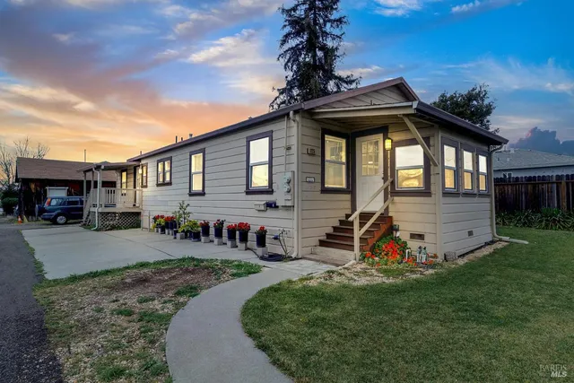 a front view of a house with garden