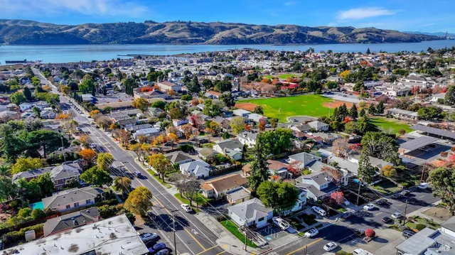 an aerial view of residential houses and outdoor space