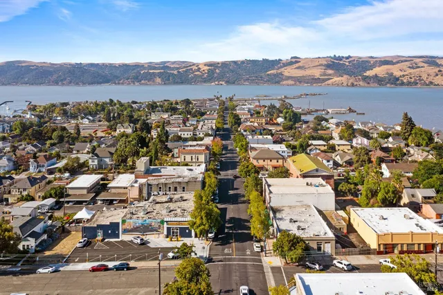 an aerial view of residential building with street view
