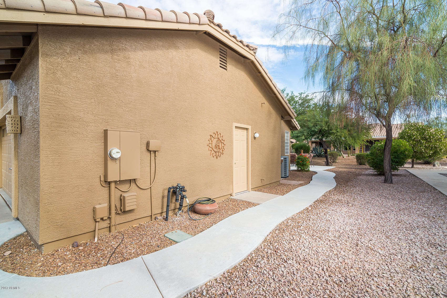 7566 Rugged Ironwood Road Gold Canyon, AZ 85118 - Photo 25 of 30 SIDEWALK FROM FRONT TO GARAGE TO BACK