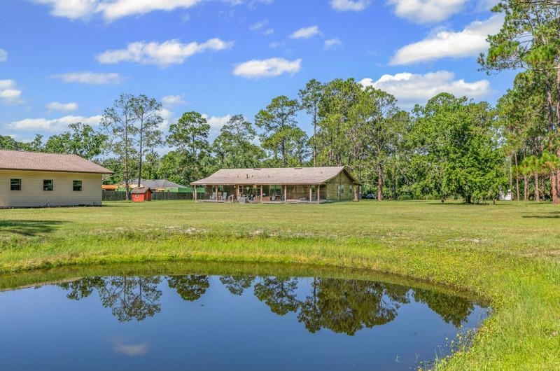 2650 Cabbage Hammock Road St. Augustine, FL 32092 - Photo 54 of 91 a view of a house with yard and a lake view