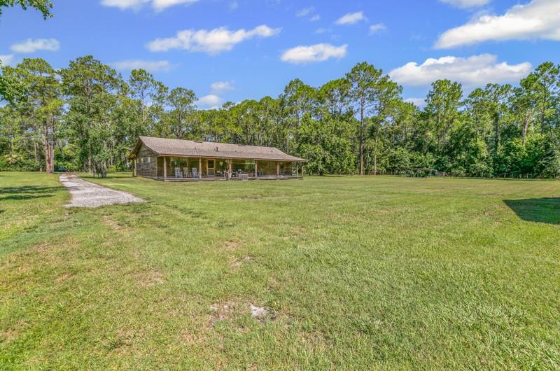 2650 Cabbage Hammock Road St. Augustine, FL 32092 - Photo 57 of 91 View of grassy yard with a view of trees