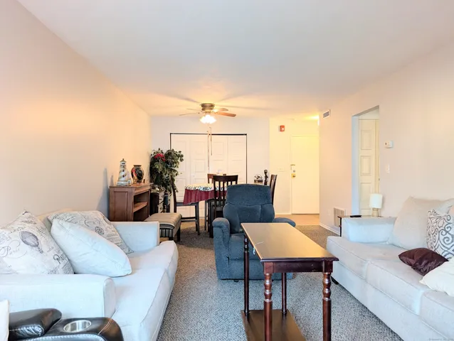 a living room with furniture and a table