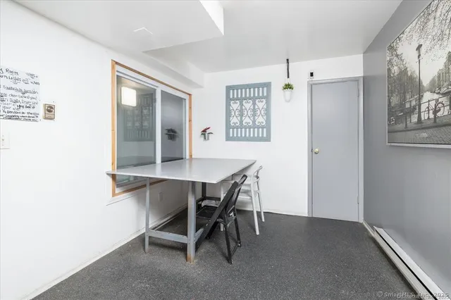 a workspace with furniture and window