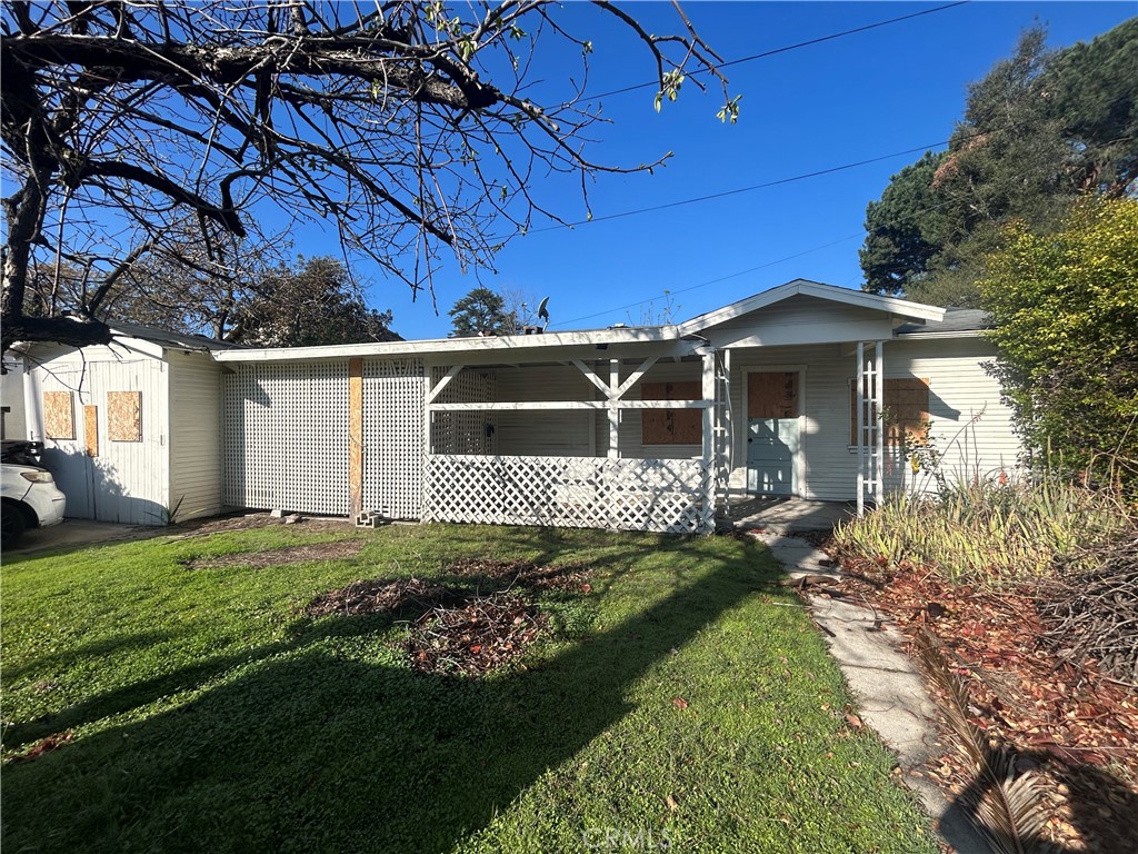 a front view of a house with a garden