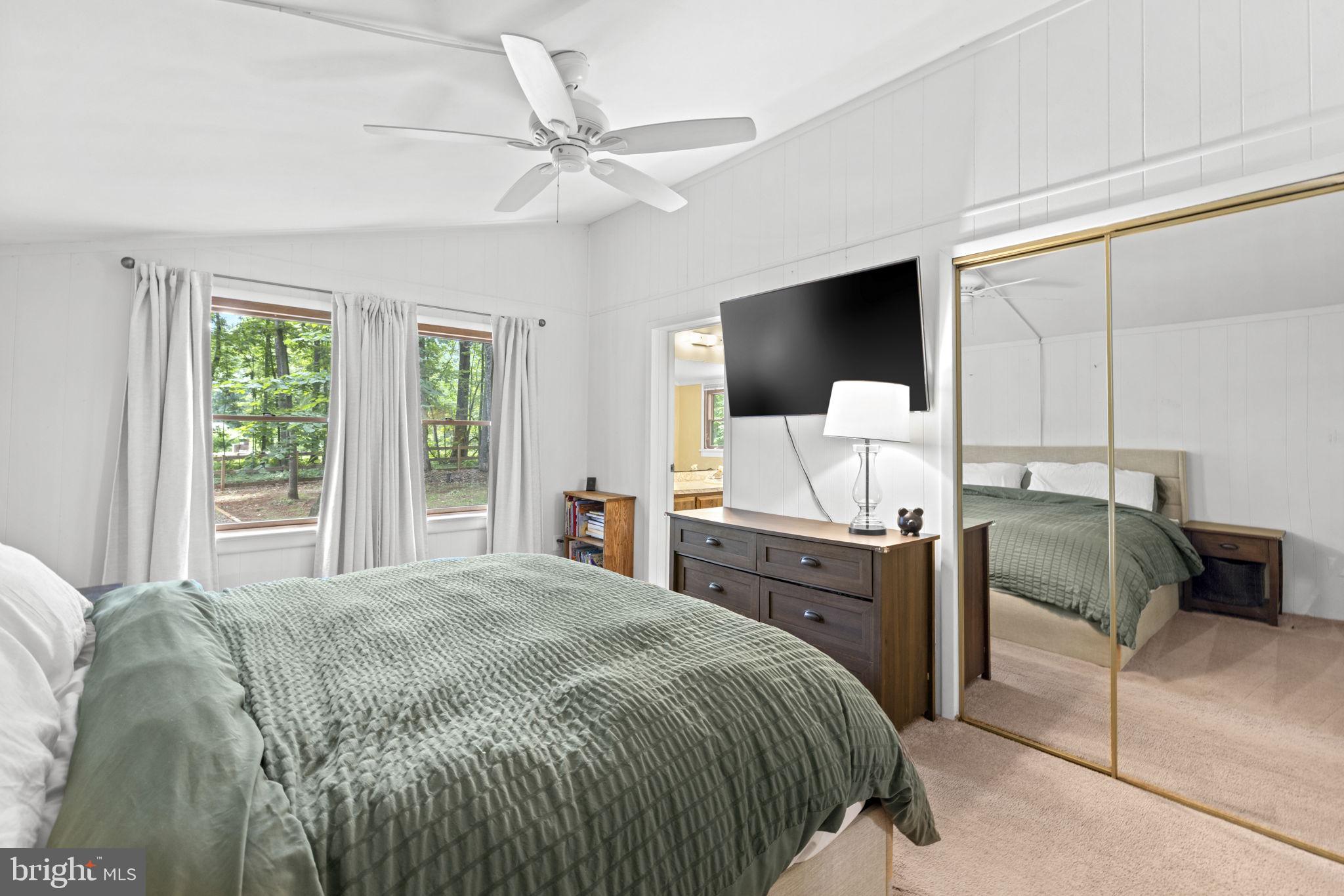9448 Green Road Midland, VA 22728 - Photo 42 of 91 a bedroom with a bed and a flat screen tv