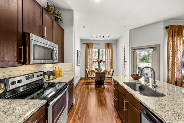 a kitchen with a stove and a sink