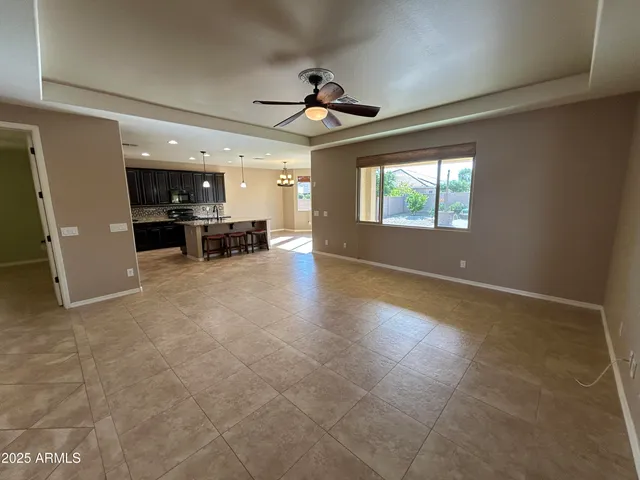 a view of a livingroom with furniture cabinets and a window