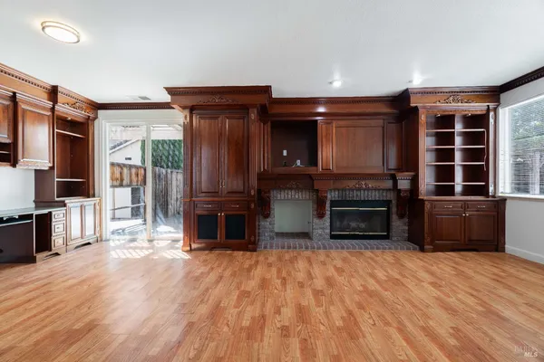 a kitchen with stainless steel appliances a stove top oven and a refrigerator