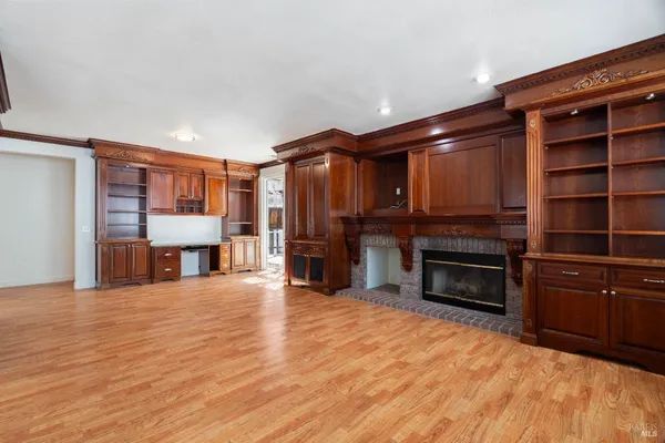 a view of a livingroom with furniture and a fireplace