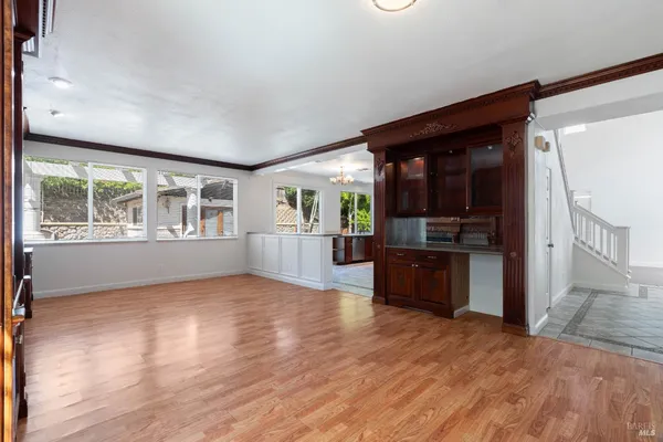 a view of kitchen with cabinets and wooden floor