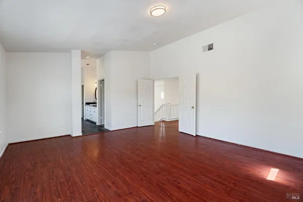 a bathroom with a bathtub a window and a shower