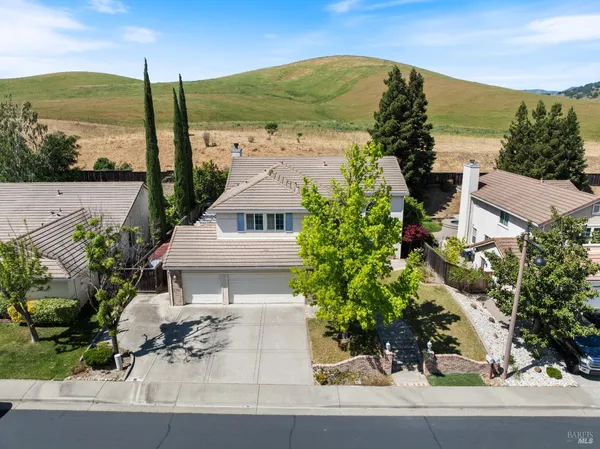a view of a garden with a building in the background