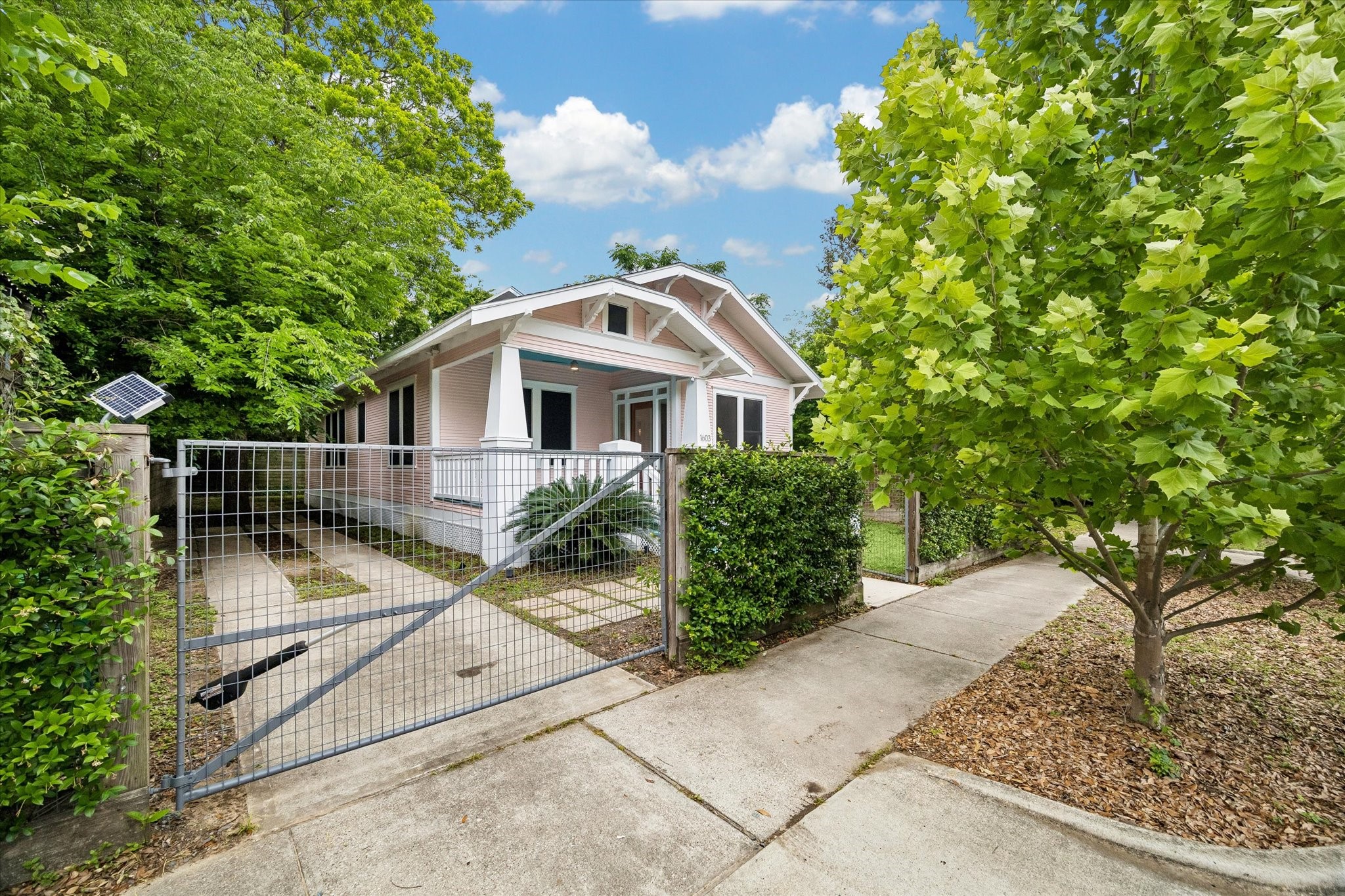1603 Fulton Street Houston, TX 77009 - Photo 2 of 28 a house with a tree in front of it