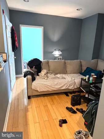 a view of a room with wooden floor