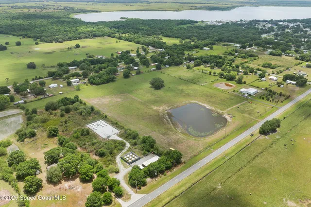 a view of swimming pool from a lake view
