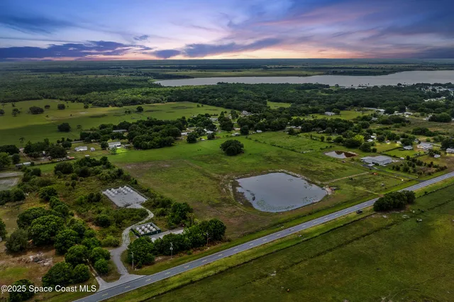 a view of a garden with an outdoor seating