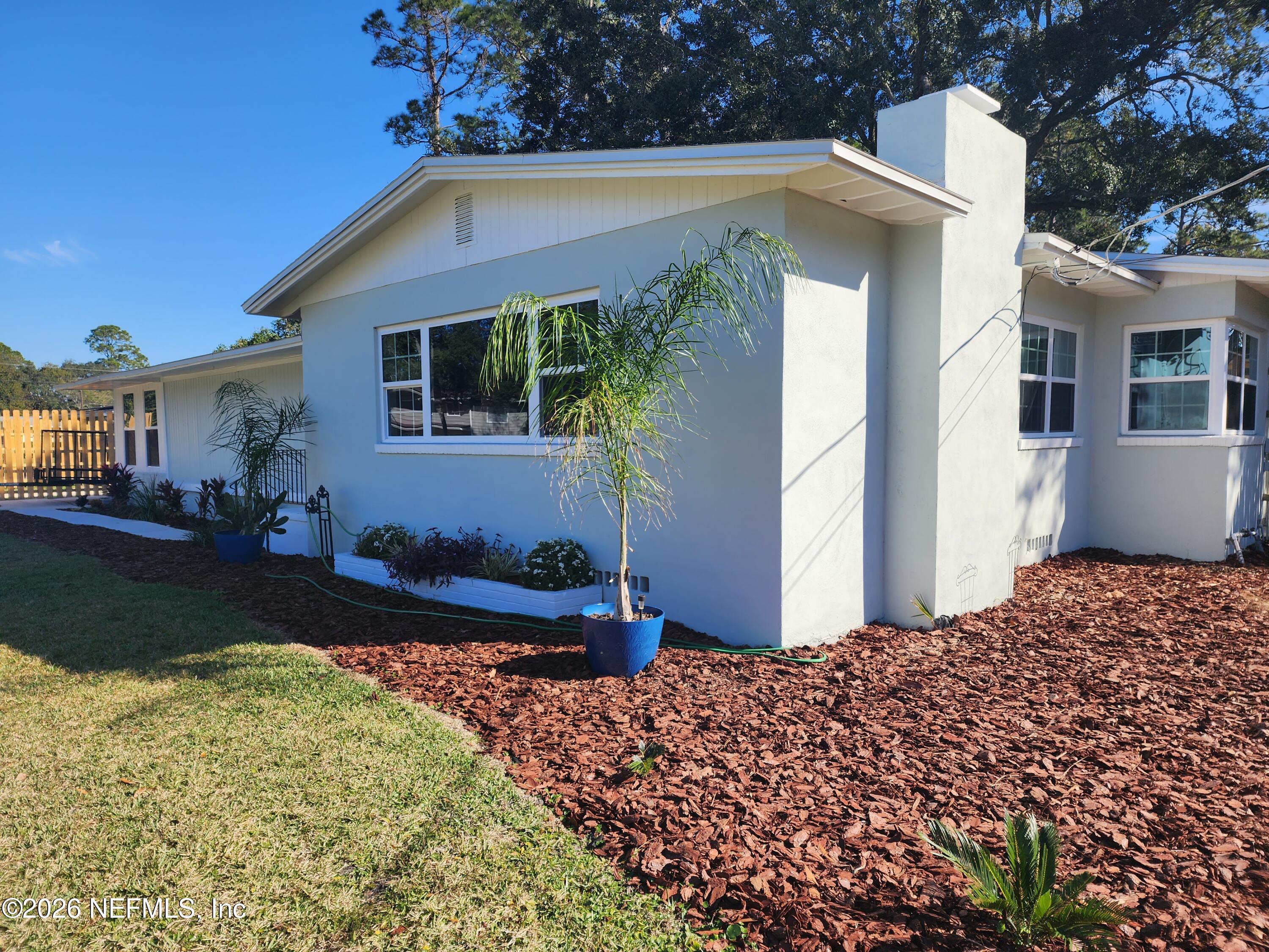 7269 Balboa Road Jacksonville, FL 32217 - Photo 1 of 24 a front view of a house with a yard