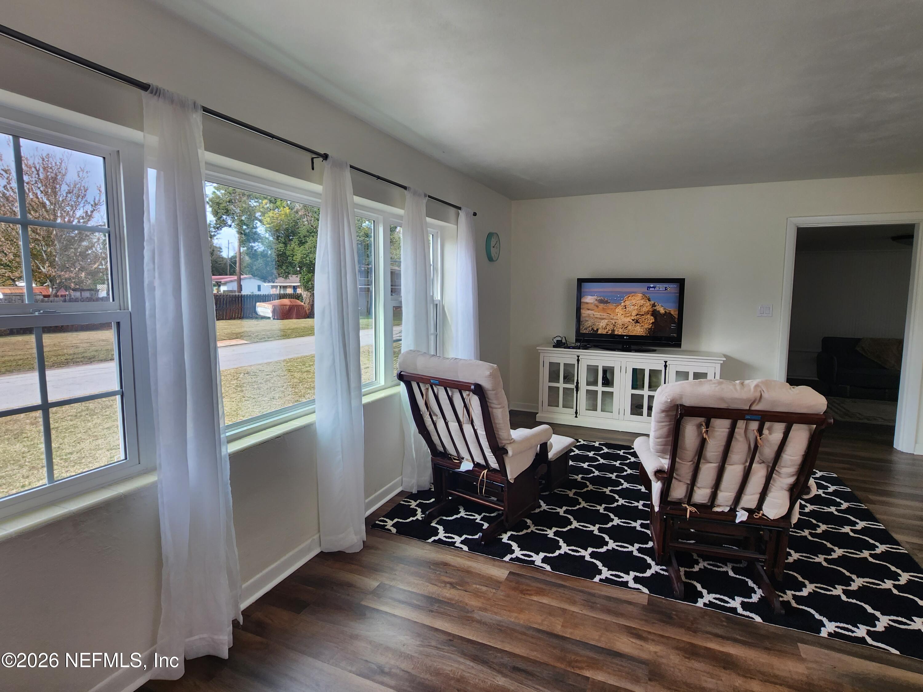 7269 Balboa Road Jacksonville, FL 32217 - Photo 11 of 24 a view of a livingroom with furniture wooden floor and windows
