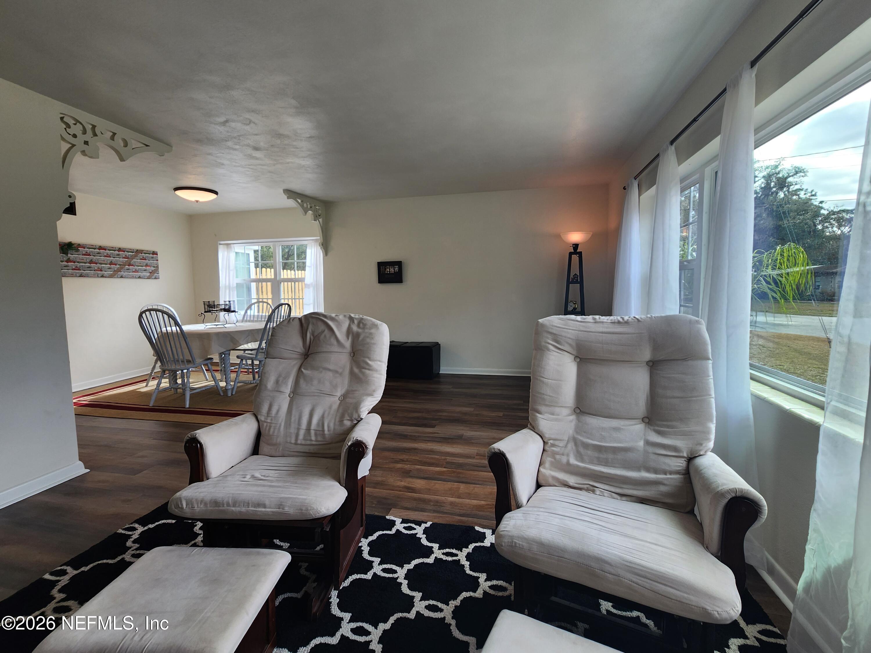7269 Balboa Road Jacksonville, FL 32217 - Photo 13 of 24 a living room with furniture and wooden floor